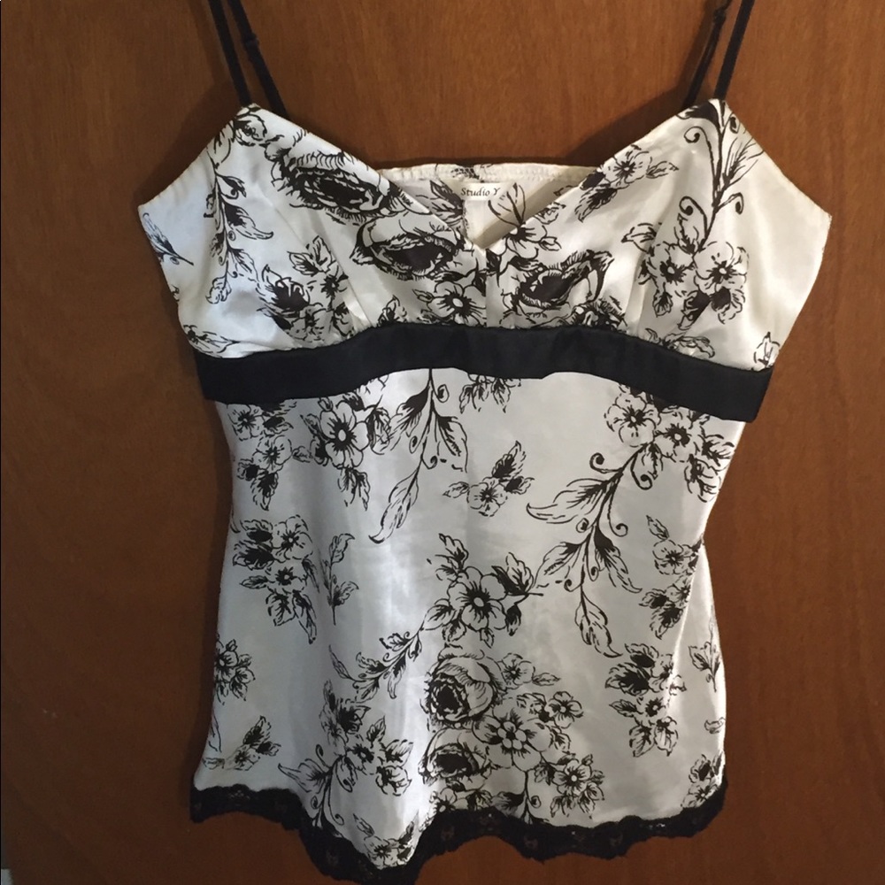 Dressed shirt with adjustable spaghetti straps.